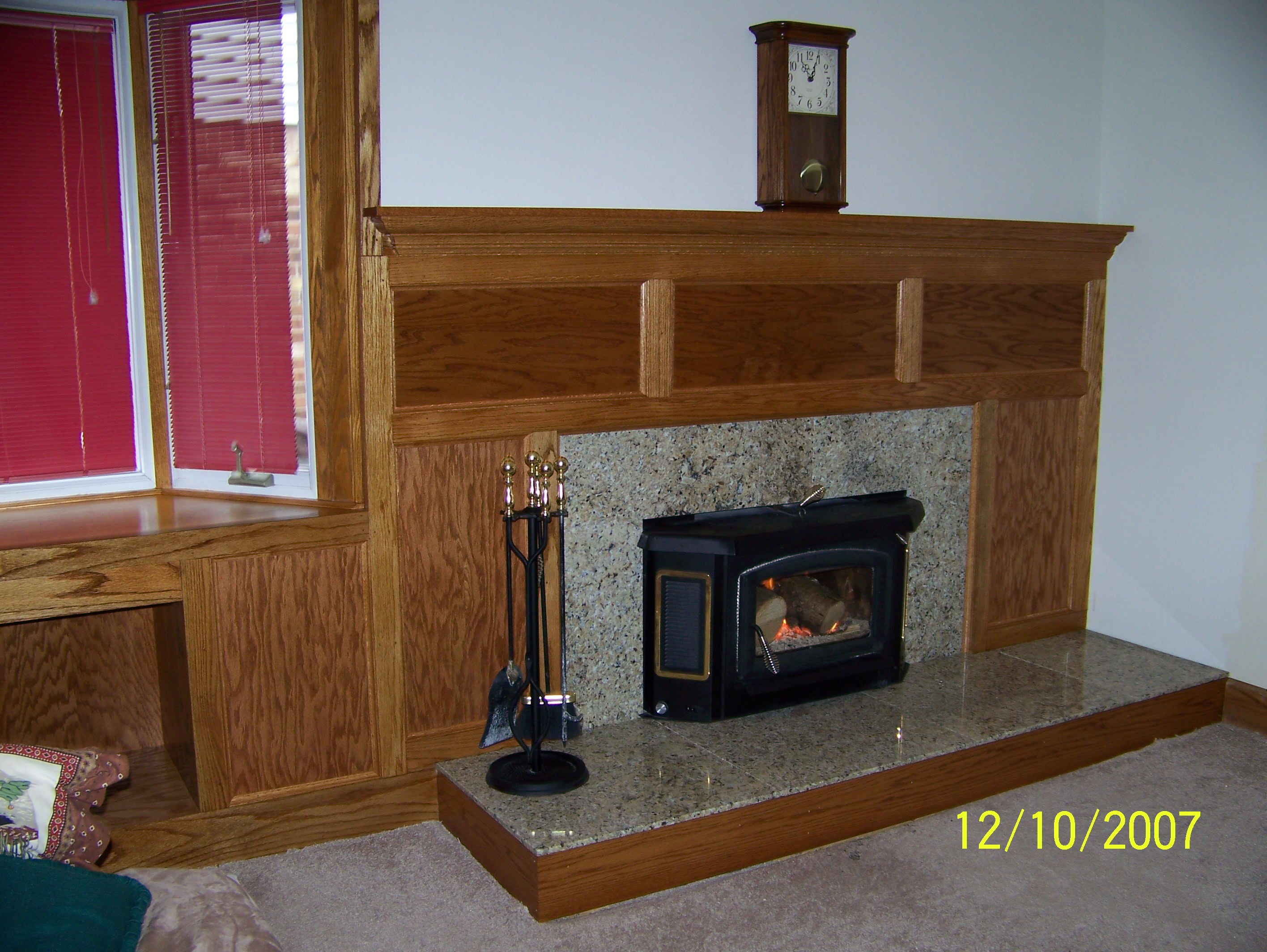 Granite and Oak Fireplace surround. www.parkohome.com
